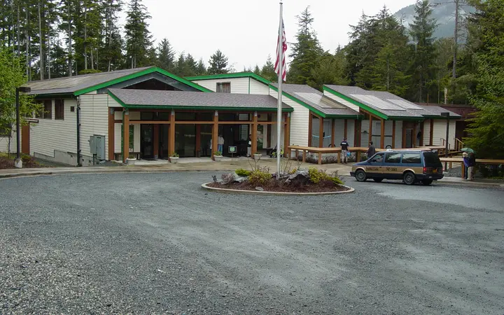 Entrance building of the Alaska Raptor Center surrounded by spruce forest