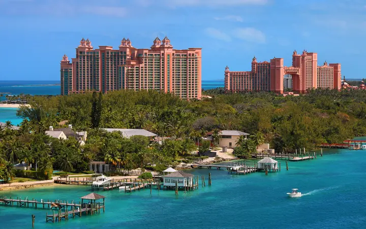The pink Royal Towers of the Atlantis resort on Paradise Island seen across turquoise water from Nassau