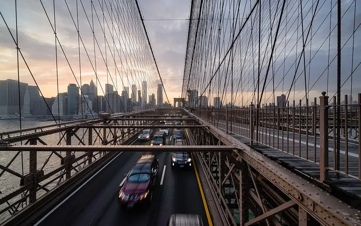 Brooklyn Bridge cables and stone tower with the Manhattan skyline