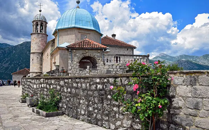Church of Our Lady of the Rocks with its blue dome on the islet off Perast