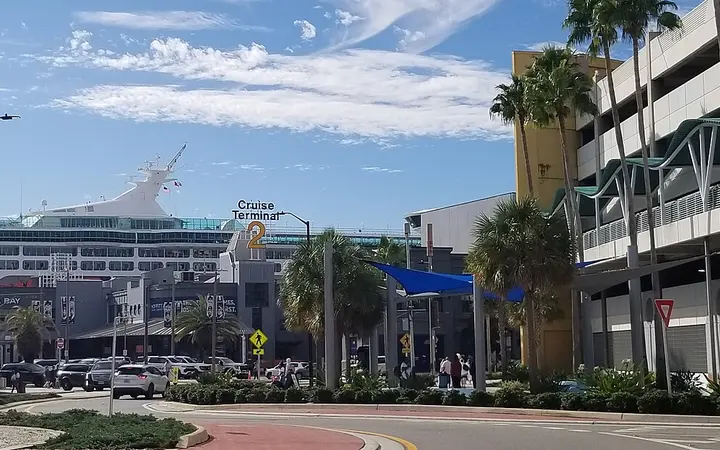 Port Tampa Bay Cruise Terminal 2 seen from the Channelside Drive roundabout with a cruise ship behind