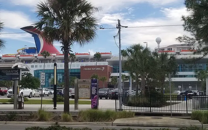 Port Tampa Bay Cruise Terminal 3 on Channelside Drive with a Carnival ship funnel behind