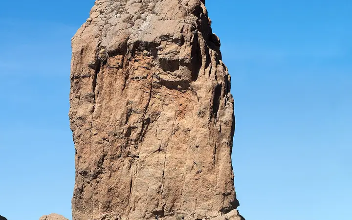 Roque Nublo rock monolith against a blue sky