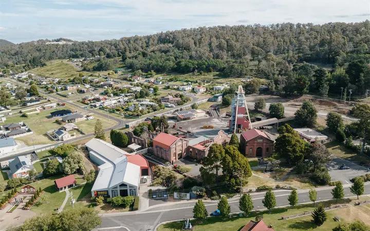 Aerial view of the Beaconsfield Mine and Heritage Centre with its mine headframe and the town around it
