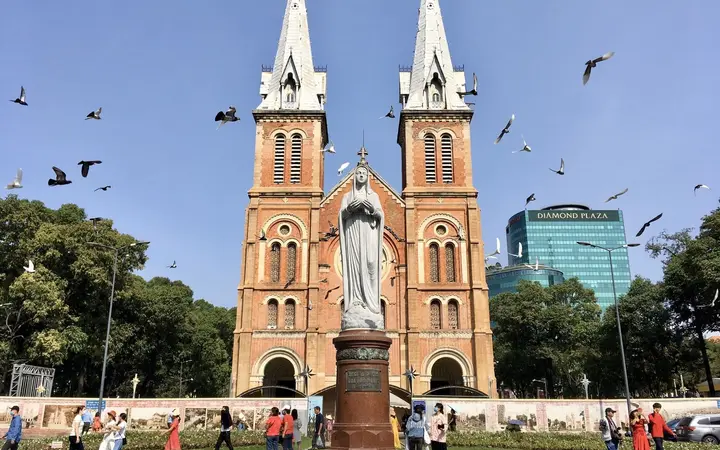 Twin spires of Notre-Dame Cathedral Saigon with the Virgin Mary statue
