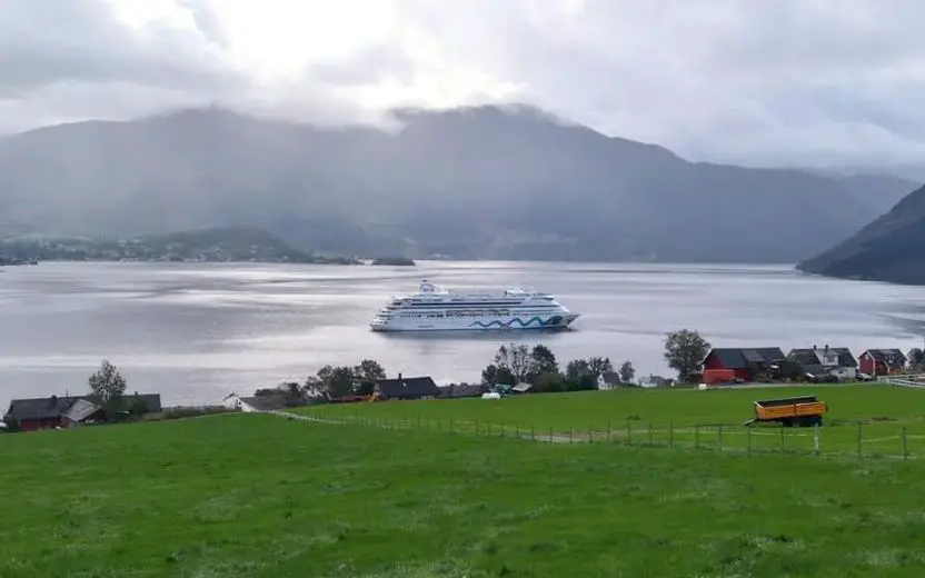 Cruise ship docked at the port of Rosendal, Norway